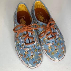 Slightly worn Disney woody vans.